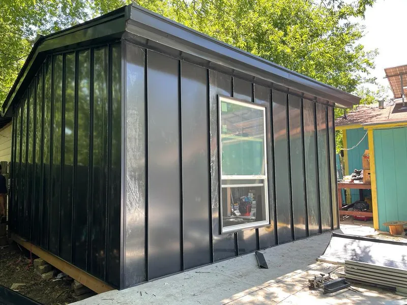 Black standing seam metal wall panels for Roof Inspection in La Presa